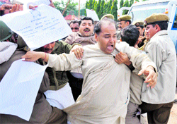 Activists of the Shiv Sena scuffle with the police during a protest in Jammu on Saturday
