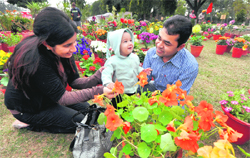 In Natures lap: Members of a family enjoy during a flower show at the Rose Garden in Ludhiana