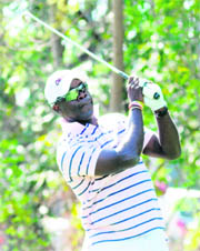 West Indian crickets team head coach Ottis Gibson plays a stroke at the Golf Club in Chandigarh on Sunday.