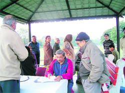 HEALTH MATTERS: Morning walkers being examined during a free health check-up camp at Fragrance Garden, Sector 36, Chandigarh, on Sunday.