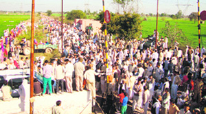 Jats block the rail track at Ramayan village near Hisar on Sunday. Photo: Manoj Dhaka