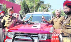 Policemen show weapons recovered from a gang in Jalandhar