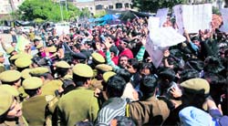 Members of the Jammu and Kashmir Agriculture Technocrats Association clash with the police in Jammu on Sunday.