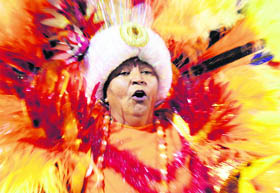 A reveller parades for Nene de Vila Matilde samba school during the carnival in Sao Paulo on Sunday. 