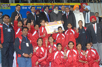 The team from Muktsar with CM Parkash Singh Badal and Deputy CM Sukhbir Badal after winning a prize at the Punjab Games that concluded in Jalandhar on Sunday.