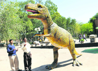 A model of a dinosaur being put up at the entrance to the Natural History Museum in Sector 10, Chandigarh, on Monday.