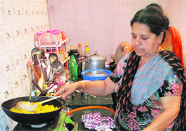 Gurjeet Kaur in her kitchen. 
