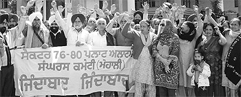 Allottees of Sectors 76 to 80 protest in front of the GMADA office in Mohali on Monday. 