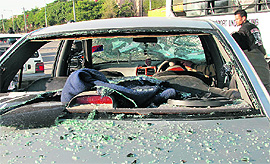 Exhibit A: Smashed windowpanes of the car of the victims after the assault