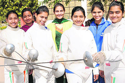 Players of the fencing team that won the bronze medal at the 34th National Games held at Ranchi. 