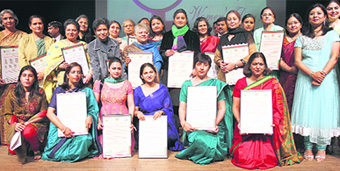 Awardees strike a pose after the award function organised by Gurukul Vidyapeeth on Monday. 