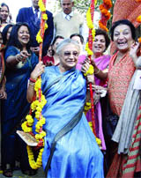 Chief Minister Sheila Dikshit enjoys on a swing on the eve of International Womens Day in New Delhi on Monday.