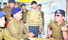 Suspect Sandeep with DIG Sanjay Gunjiyal, SP KL Shaw and ASP Nivedita Kukreti at City Kotwali in Haridwar on Monday. 