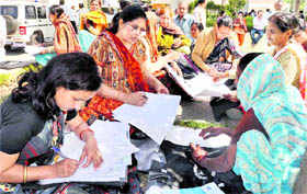 Census officials prepare their documents before submitting these at the mini-secretariat in Faridabad on Monday.
