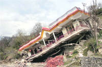 A house collapsed in Kullu on Monday. 