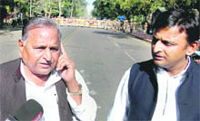 Samajwadi Party chief Mulayam Singh Yadav with his son and partys Uttar Pradesh unit chief Akhilesh Yadav in Lucknow on Monday