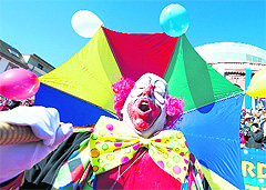 A clown celebrates in the streets of Mainz, Germany, during the Rose Monday parade on Monday.  AFP