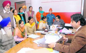 Regional Passport Officer Perneet Singh listens to the grievances of the passport seekers in Jalandhar