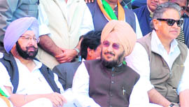 Owner of Hotel Radisson Gautam Kapoor (extreme right) sitting on a dais along with Punjab Congress chief Amarinder Singh during a district-level rally in Jalandhar Cantonment on Sunday.