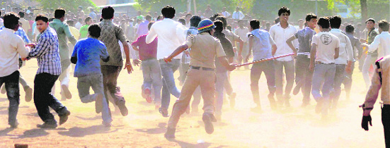 Police personnel lathicharge cricket fans after a chaos broke out during the sale of tickets for the World Cup match between India and South Africa, outside the Vidharbha Cricket ground in Nagpur on Tuesday. Later, the Vidarbha Cricket Association apologised for the use of force and inconvenience caused to cricket fans