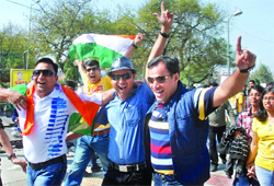 Fans enjoy the cricket World Cup 2011 match between India and the Netherlands at Ferozeshah Kotla Stadium in New Delhi