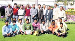 BHEL executives pose with the companys team of florists in Haridwar on Wednesday. 