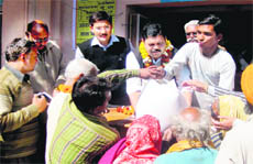 Persons in the APL-BPL categories jostle for foodgrains being given at subsidised rates under the Atal Khadyann Yojana at a government ration shop in Haridwar on Wednesday. 