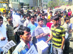 Residents hold a protest against a blocked road in Gurgaon