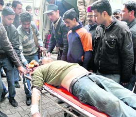 An injured person being rushed to the IGMC, Shimla, after a bus rolled down into a gorge in Aani subdivision