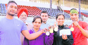 Athletes, along with their coaches, in a jubilant mood at the Guru Nanak Stadium in Ludhiana. 
