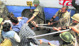 IRON HAND: Cops lathicharge Samajwadi Party workers, who were protesting against the BSP government in Uttar Pradesh, in Allahabad on Wednesday.