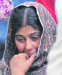 The grieving mother of Radhika Tanwar, a Delhi college student who was shot dead on Tuesday.