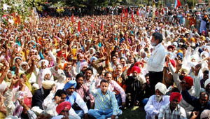 CPI leader Jagroop Singh addressing the rural folk working under the Rural Employment Guarantee Scheme during a protest outside the Mini-Secretariat at Moga on Wednesday.