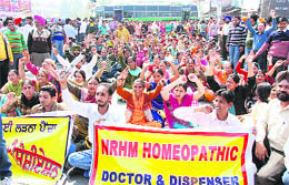 NRHM Employees Association staged a protest in the city on Thursday demanding regularisation of their services.