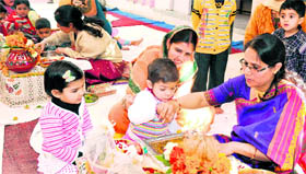 Teachers in presence of parents perform vidya sanskar at the Swami Hariharanand Pre-primary School in Kankhal, Haridwar.