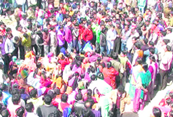 Villagers block the National Highway-125 in Pithoragarh