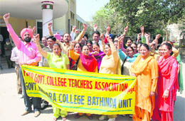Members of the Punjab Government College Teachers Association hold a protest in support of their demands in Bathinda on Thursday.