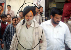 Union Bank security guard Baksheesh Singh in police custody after the incident in Abohar.