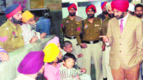 Deputy Commissioner Kahan Singh Pannu interacts with family members of mentally ill patients in Amritsar.