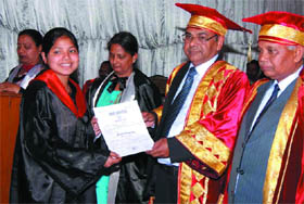 Dr Pawan Kumar Singla, Controller of Examinations, Punjabi University, Patiala, awarding degree to a student during the annual convocation at the Government Rajindra College in Bathinda on Friday. College principal Sukhchain Rai Garg is also seen in the picture.