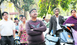  With anxiety writ large on their faces, parents wait for the result of the draw of lots for admission to a minority school in Chandigarh on Friday
