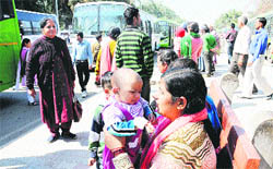 Shanti Rani, a resident of Jagadhari, with her baby, who underwent a surgery at the PGI, waits for a CTU bus. 