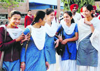 Students of Class XII come out of an examination centre at Government Senior Secondary School in Mohali on Friday. 