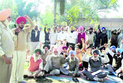 Waiting to be heard: Members of the Punjab Government Transport Workers Union stage a protest in Jagraon on Friday.