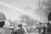 Police turns on a water canon to disperse the Congress workers to prevent them from crossing a barricade in Sector 35, Chandigarh,