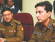 Delhi police commissioner Brijesh Kumar Gupta (L) and H.G.S Dhaliwal, DCP, South address a press conference in New Delhi on Saturday. Tribune photo