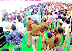 Policemen wield lathis on unruly students at SMJN College during the annual function in Haridwar