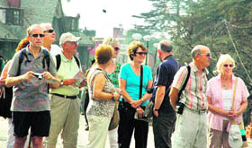 Foreigners enjoy pleasant weather at the Ridge in Shimla on Saturday.
