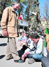 A dental student polishes shoes of a passerby to press for their demands at the Indira Gandhi Medical College and Hospital in Shimla on Saturday.