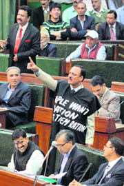 PDP legislator Abdul Haq Khan protests against shortage of ration in his constituency, in the Legislative Assembly in Jammu on Saturday.